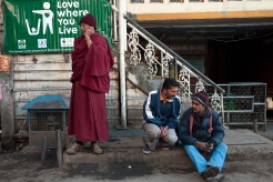 Porters and a Tibetan monk in the main square, McLeodganj, Dharamshala, India. Photo by Angus McDonald