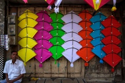 Kites for sale in Baroda, Gujarat, India ahead of the annual Uttarayan, or Makar Sakranti, kite flying festival. Photo by Angus McDonald